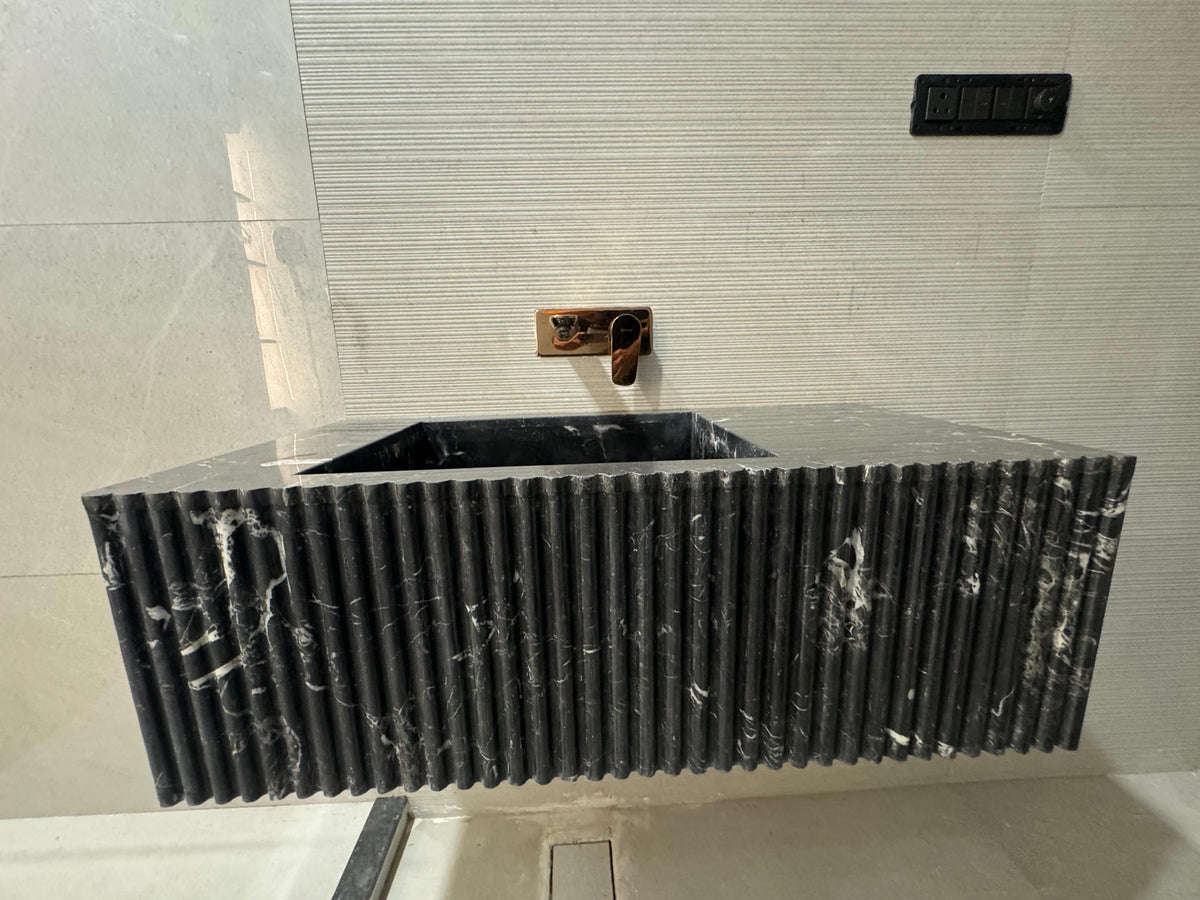 Black marble sink. Wall mounted bathroom sink