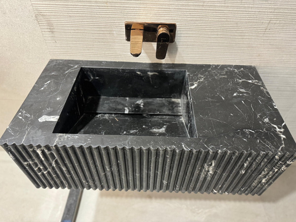 black fluted marble sink, a luxurious and modern choice for those seeking unique bathroom sink ideas.