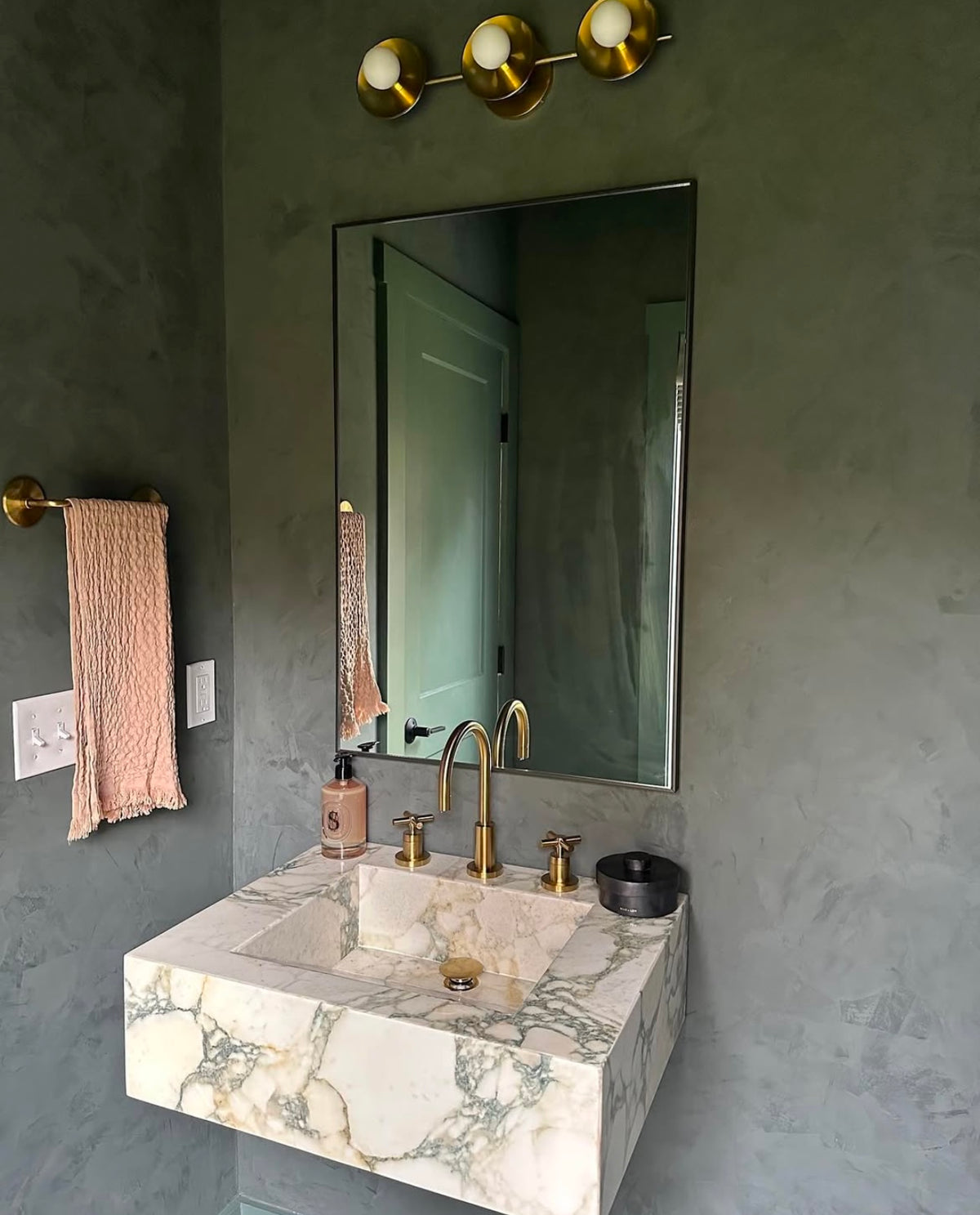 Calacatta viola marble sink shown as a floating marble sink and marble vessel sink in a modern bathroom setting