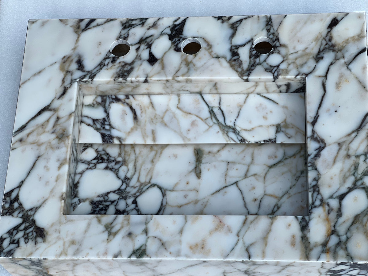 Compact small marble sink featured as a marble wall hung sink, ideal for modern powder rooms and space-saving bathroom designs