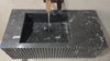 Video showcasing a handcrafted black marble sink with fluted design and custom dimensions, perfect for luxury bathroom vanities.